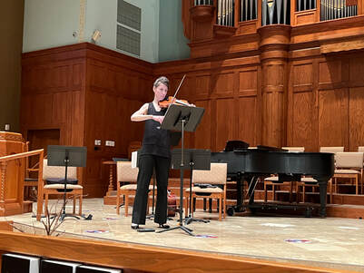Ioana Galu performs Connor's solo work for violin.